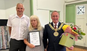 Photo shows Russell, Anne with her award and the Mayor of Southend presenting flowers.